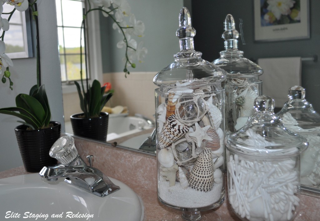 Glass jars filled with sand and shells look great in any bathroom